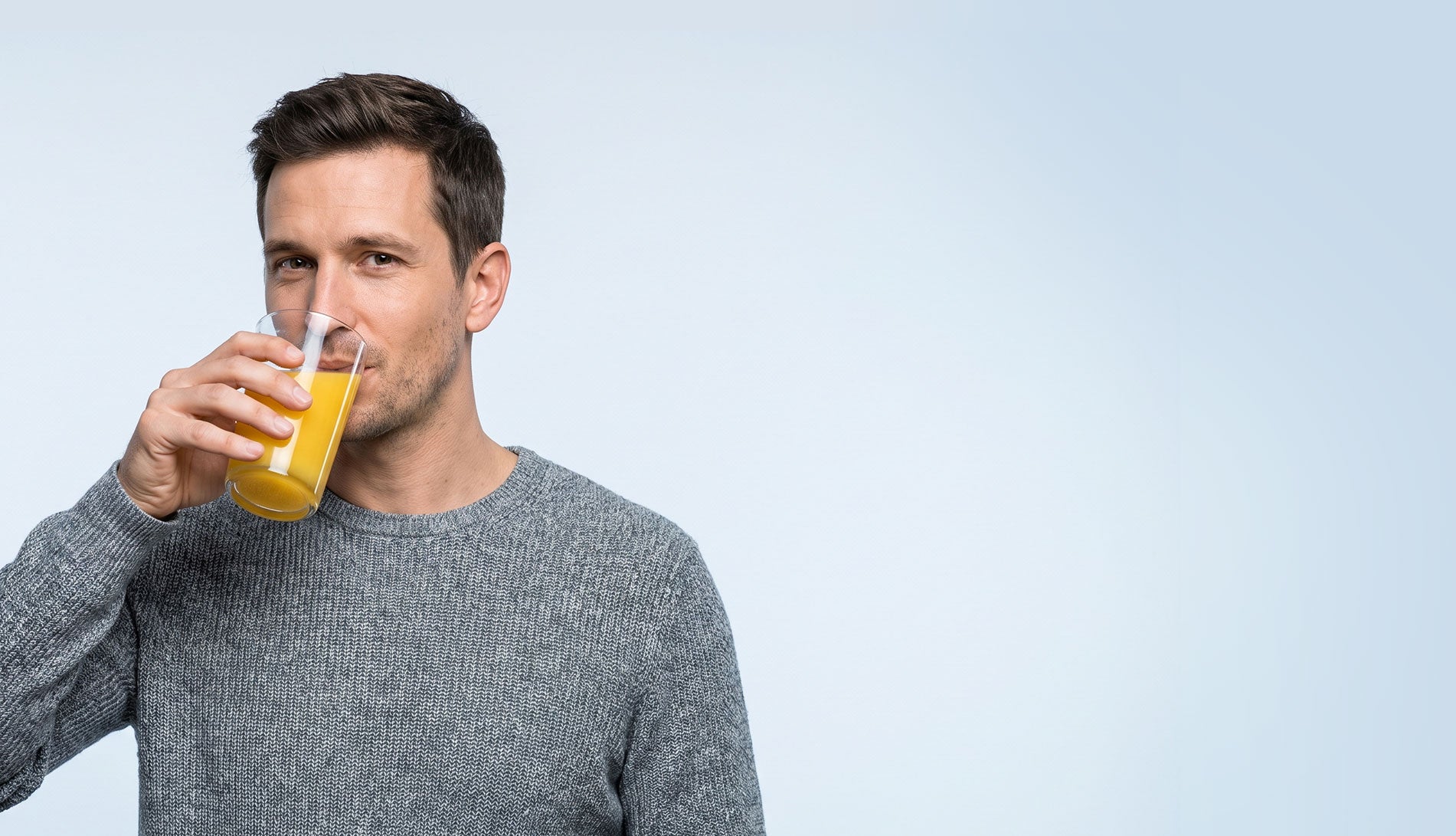 Man drinking Banatrol Plus mixed with juice
