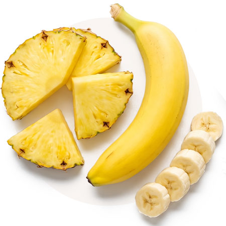 Banana, pineapple, and sliced fruit