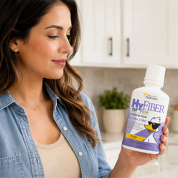 Woman holding HyFiber for Kids bottle